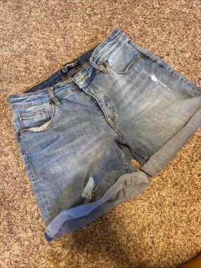 High-Rise Light Blue Distressed Denim Shorts with Rolled Hem